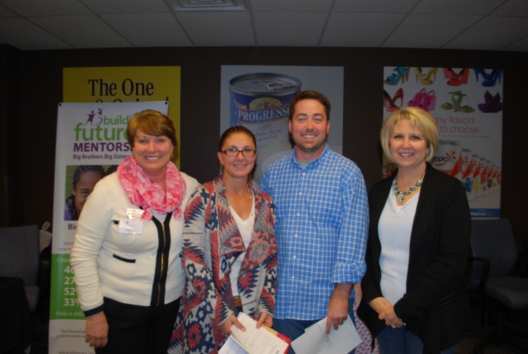 Vicki Cowling of Susan G. Komen Ozark Affiliate stands with Cathy Smith, Peter Lee and Mary Zettle of General Mills